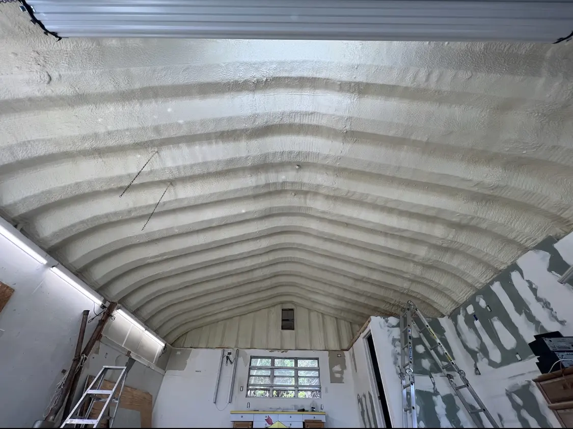Spray polyurethane foam applied to the underside of a metal roof deck in Powdersville